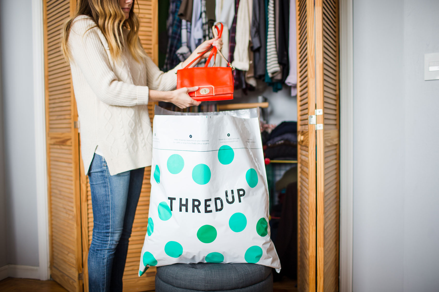 Woman putting clothes into a bag.