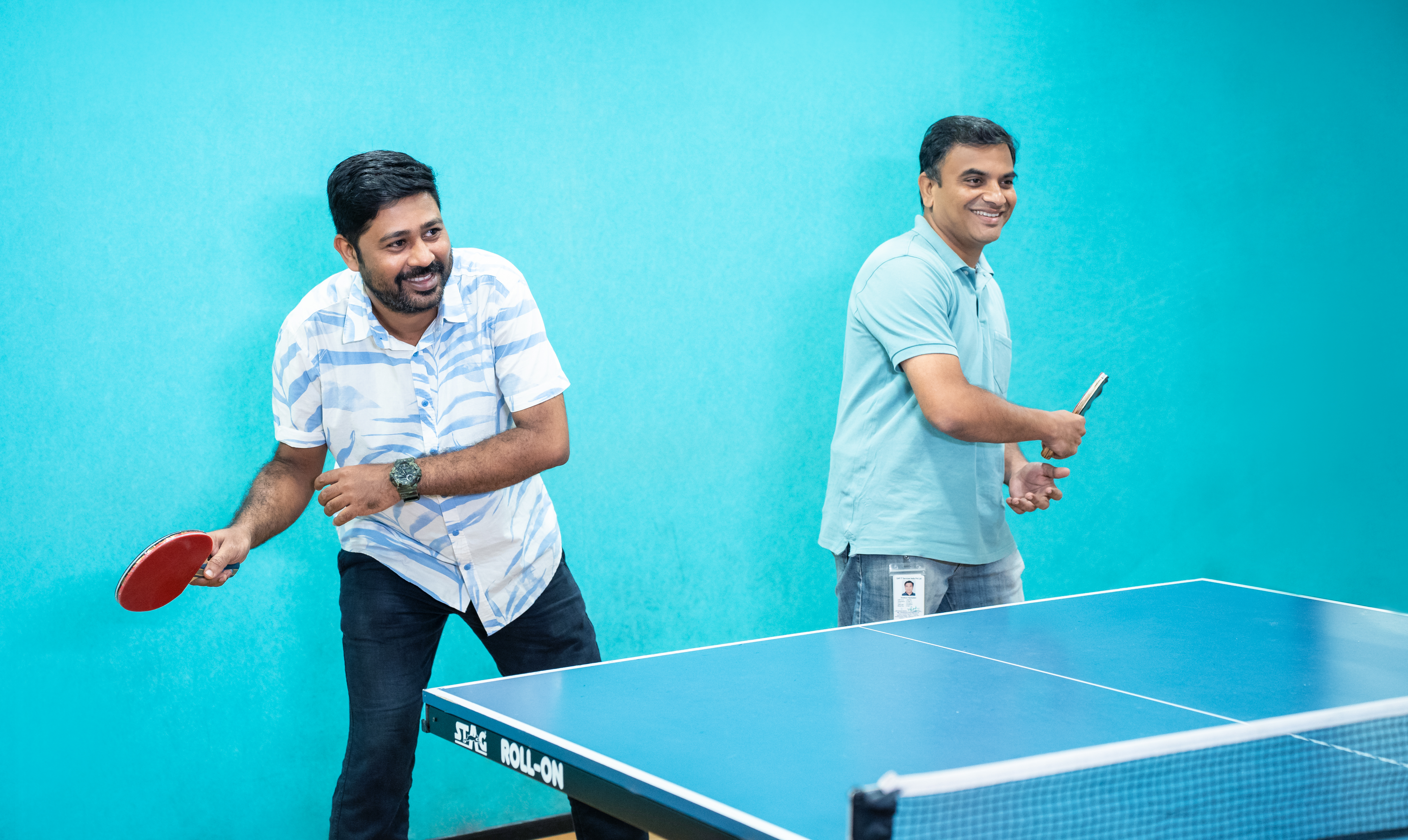 Employees playing table tennis