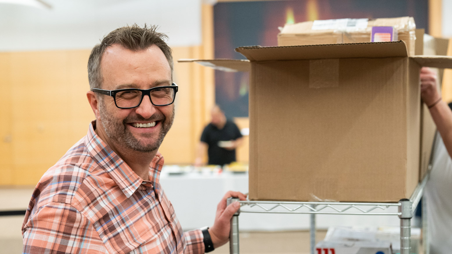 Employee with Box on a Cart